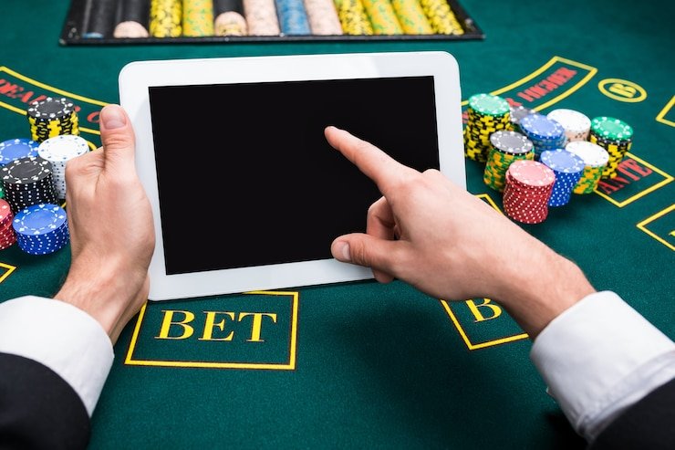 Live roulette wheel spinning with betting board showing chip placements and bet amounts